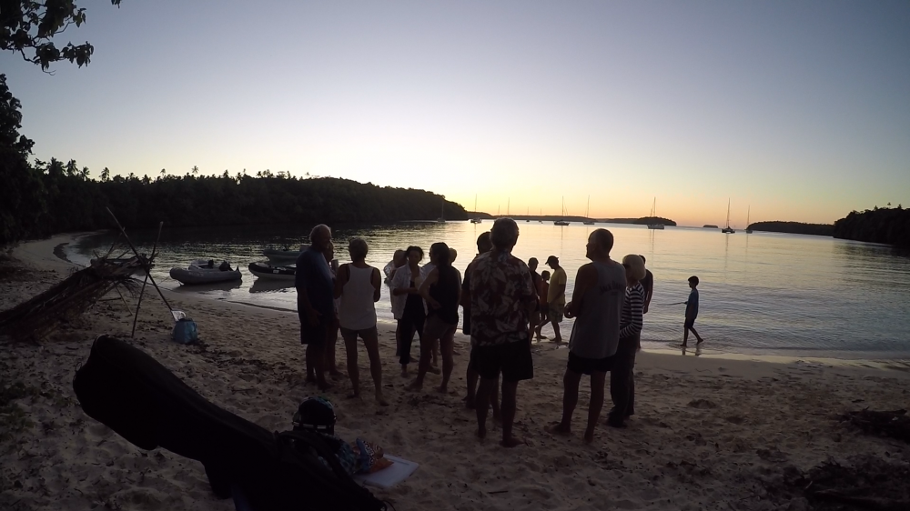 Sunset: Sundowners and fire ashore at Port Muriel
